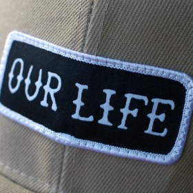 OUR LIFE SOCKS PATCH SNAPBACK CAP